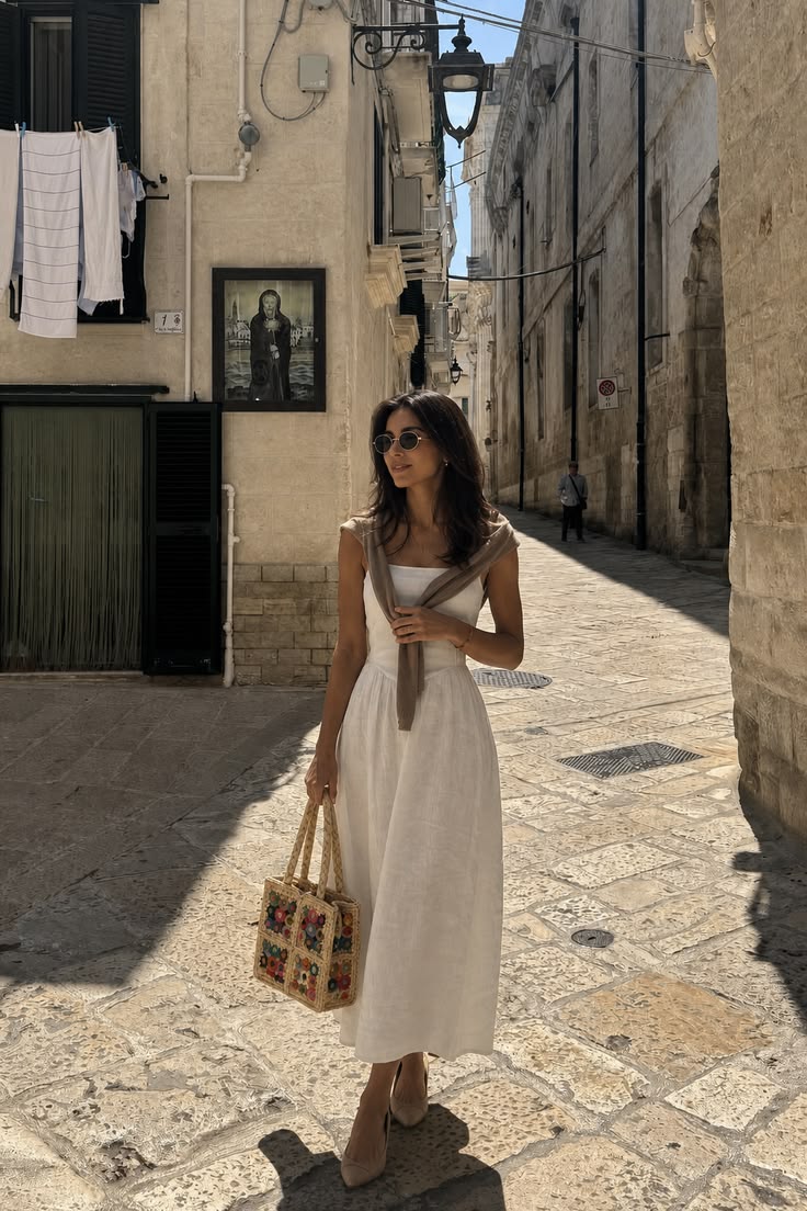 the little raffia bag that makes a plain dress look intentional
