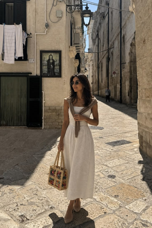 the little raffia bag that makes a plain dress look intentional